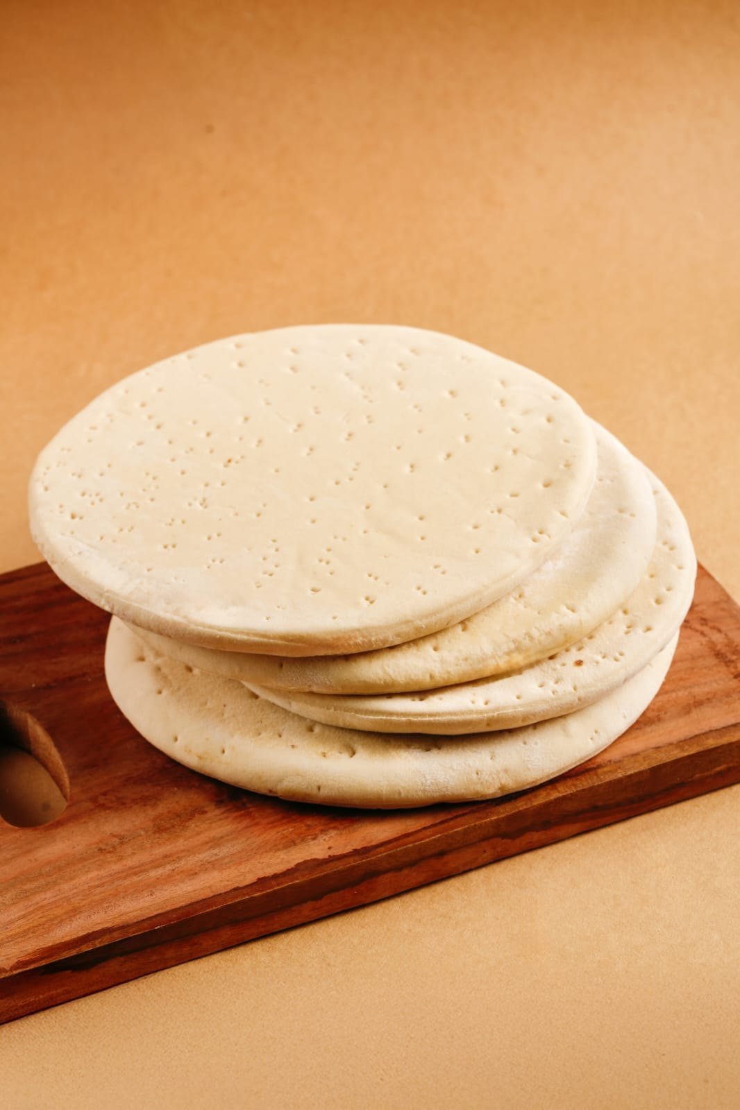 Fresh par-baked pizza bases in multiple commercial sizes